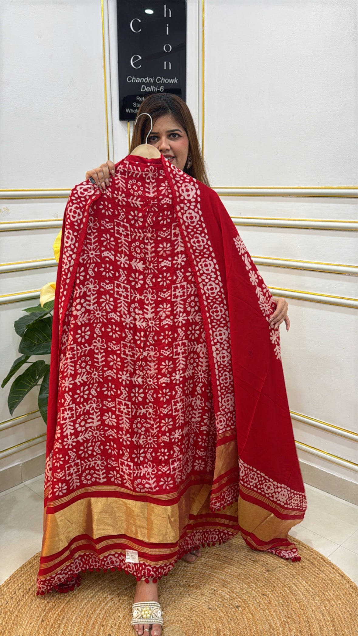 Trendy cotton modal unstitched suit in red with floral patterns and gold accents for stylish outfits